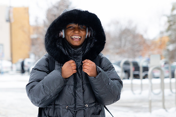A student bundles up to stay warm from the cold temperatures.