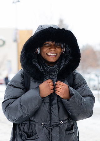 A student bundles up to stay warm from the cold temperatures.