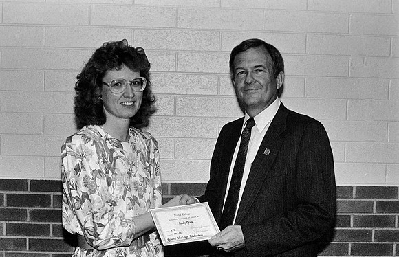 Cindy Nelson receiving a scholarship from Senator Stallings.