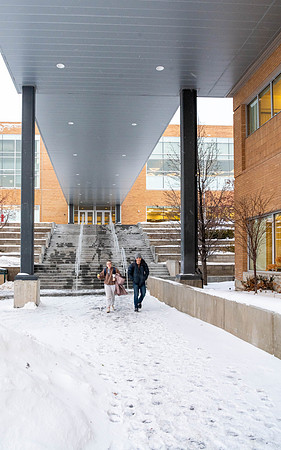 Students walk to the David O Mckay library after a light snow fall.