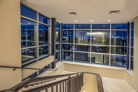 A stairwell in the Manwaring Center looking out onto the Taylor plaza.