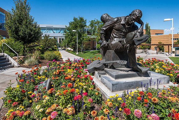 A glorious summer day at BYU-Idaho with flowers arrayed in all their beauty.  Centennial Sculpture