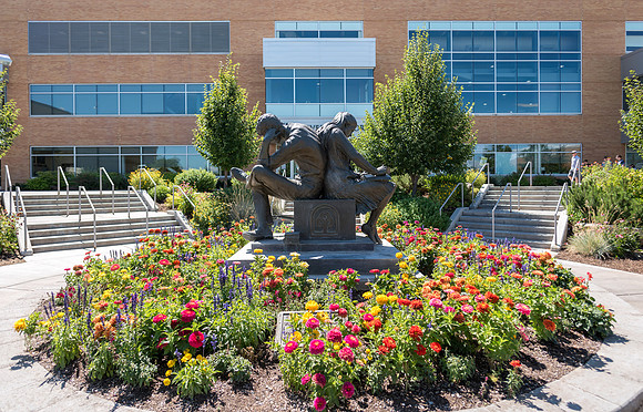 A glorious summer day at BYU-Idaho with flowers arrayed in all their beauty.  Centennial Sculpture