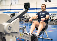 A student using the rowing machine at the Hart Fitness Center.