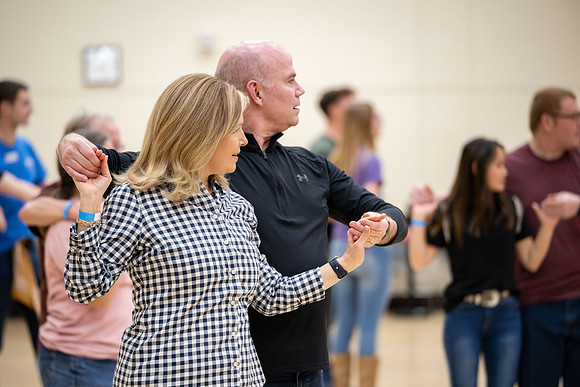 President and Sister Meredith try country dancing.