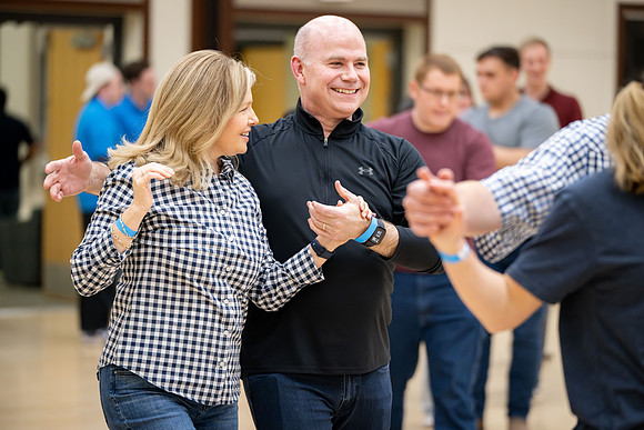 President and Sister Meredith try country dancing.