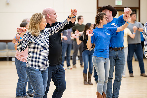 President and Sister Meredith try country dancing.