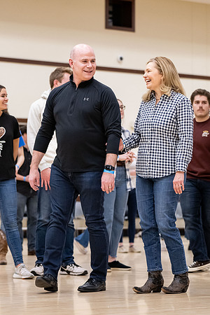 President and Sister Meredith try country dancing.
