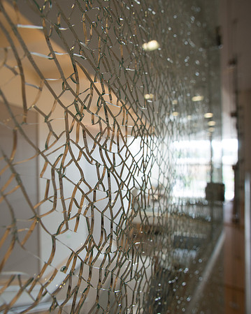 New glass installed in BYU-Idaho Center sporting a web of cracks.