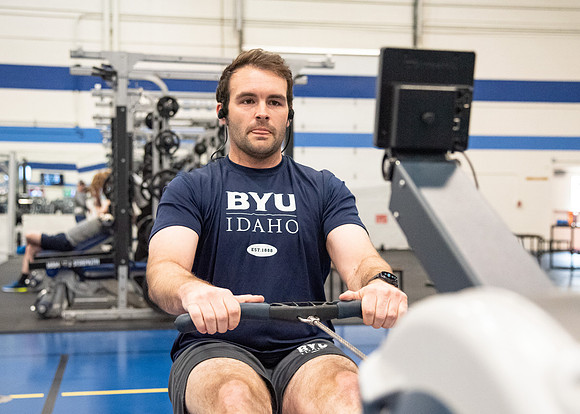 A student using the rowing machine at the Hart Fitness Center.