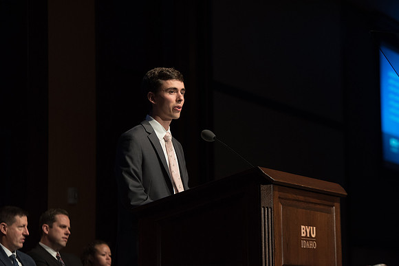 A student reads a scripture during devotional.