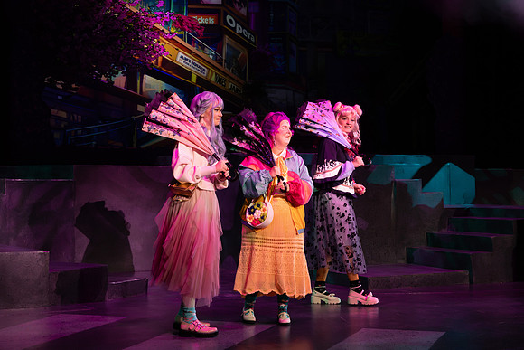 Students performing in the play The Mikado.