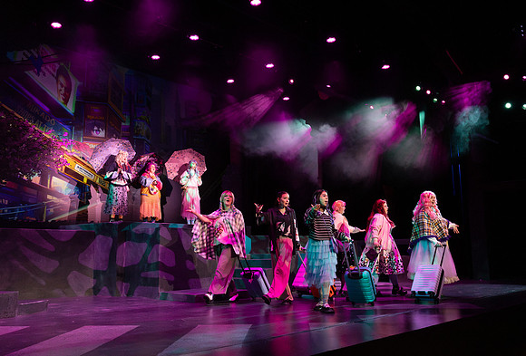 Students performing in the play The Mikado.
