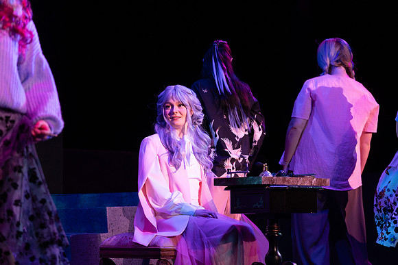 Students performing in the play The Mikado.