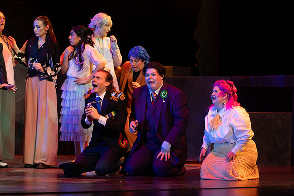 Students performing in the play The Mikado.
