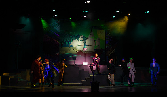 Students performing in the play The Mikado.