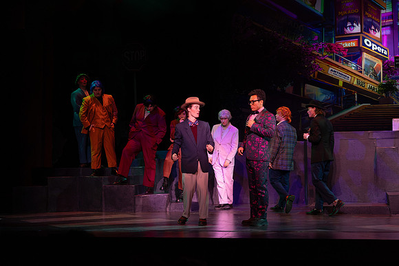 Students performing in the play The Mikado.
