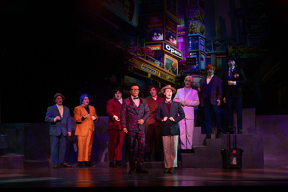 Students performing in the play The Mikado.