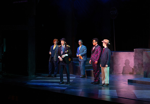 Students performing in the play The Mikado.