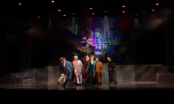 Students performing in the play The Mikado.