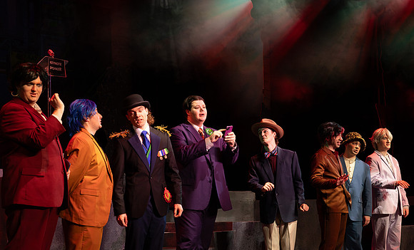 Students performing in the play The Mikado.