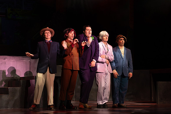 Students performing in the play The Mikado.