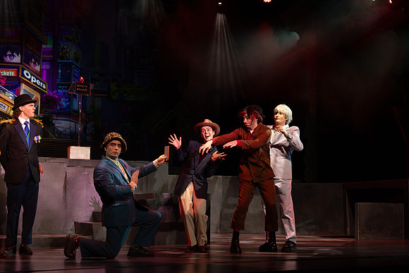 Students performing in the play The Mikado.