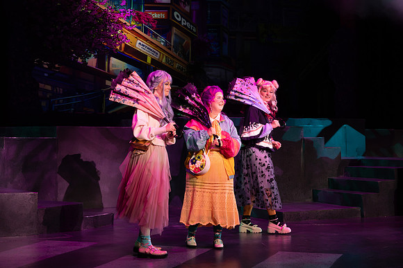 Students performing in the play The Mikado.