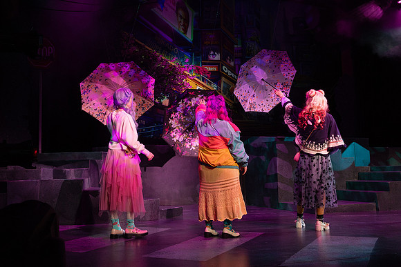 Students performing in the play The Mikado.