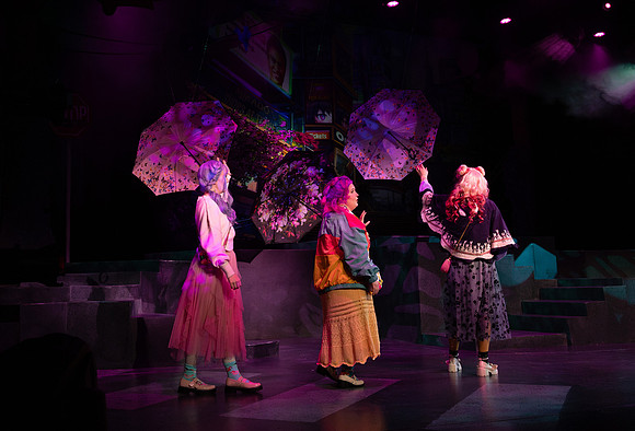 Students performing in the play The Mikado.