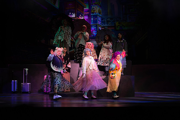 Students performing in the play The Mikado.
