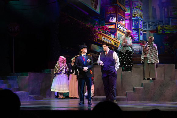 Students performing in the play The Mikado.