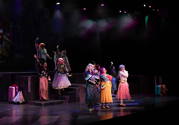 Students performing in the play The Mikado.