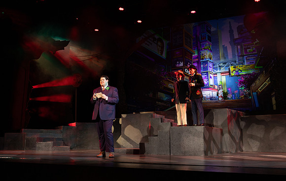 Students performing in the play The Mikado.