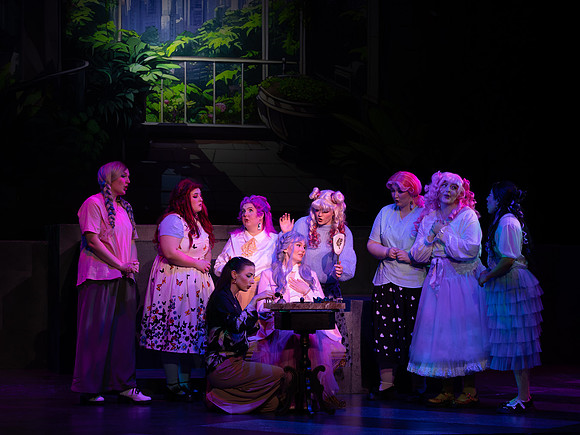 Students performing in the play The Mikado.