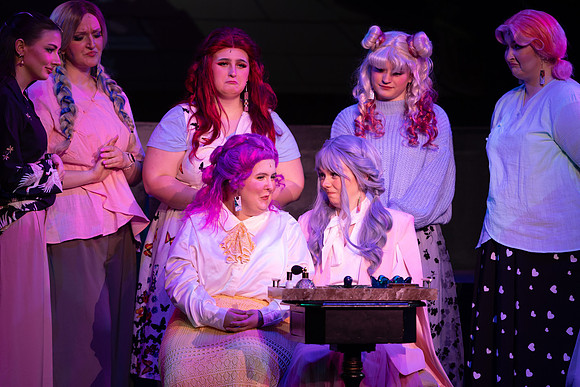 Students performing in the play The Mikado.