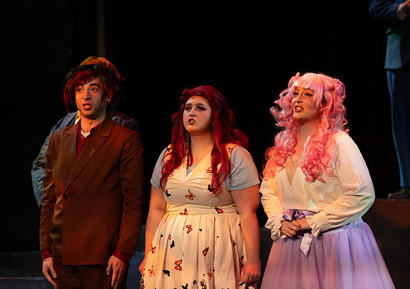 Students performing in the play The Mikado.