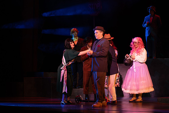 Students performing in the play The Mikado.