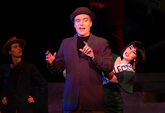 Students performing in the play The Mikado.