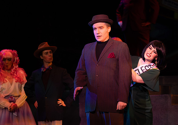 Students performing in the play The Mikado.