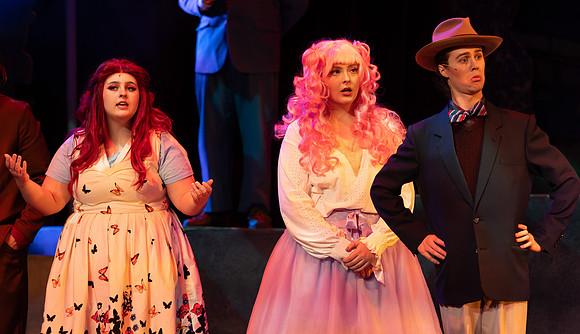 Students performing in the play The Mikado.