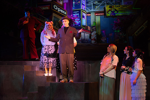Students performing in the play The Mikado.