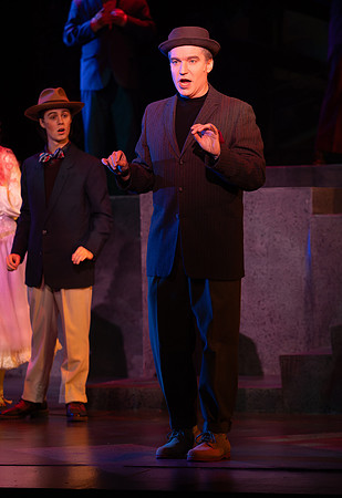 Students performing in the play The Mikado.