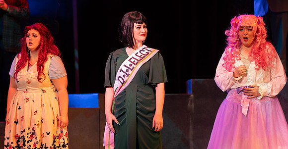 Students performing in the play The Mikado.