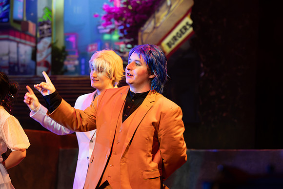 Students performing in the play The Mikado.