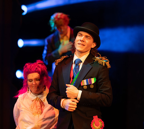 Students performing in the play The Mikado.