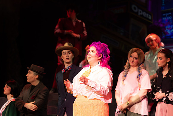 Students performing in the play The Mikado.