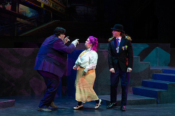 Students performing in the play The Mikado.