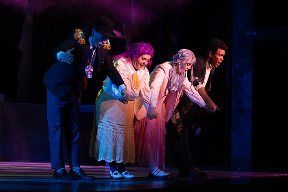 Students performing in the play The Mikado.
