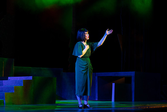 Students performing in the play The Mikado.
